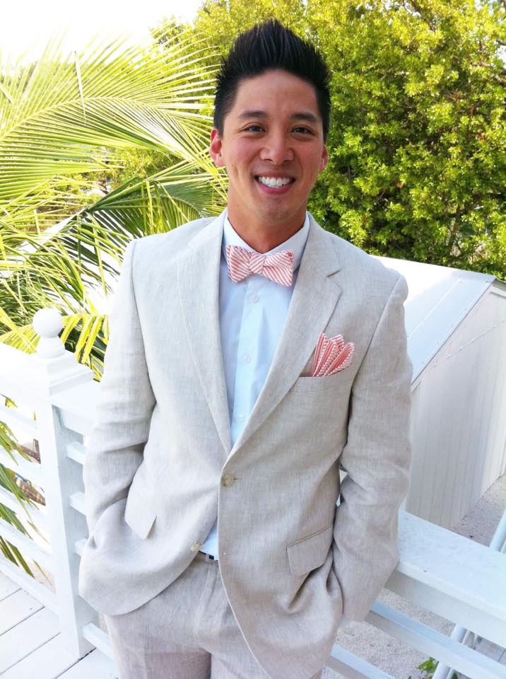 Huy Huynh โ smiling in a linen suit and bow tie